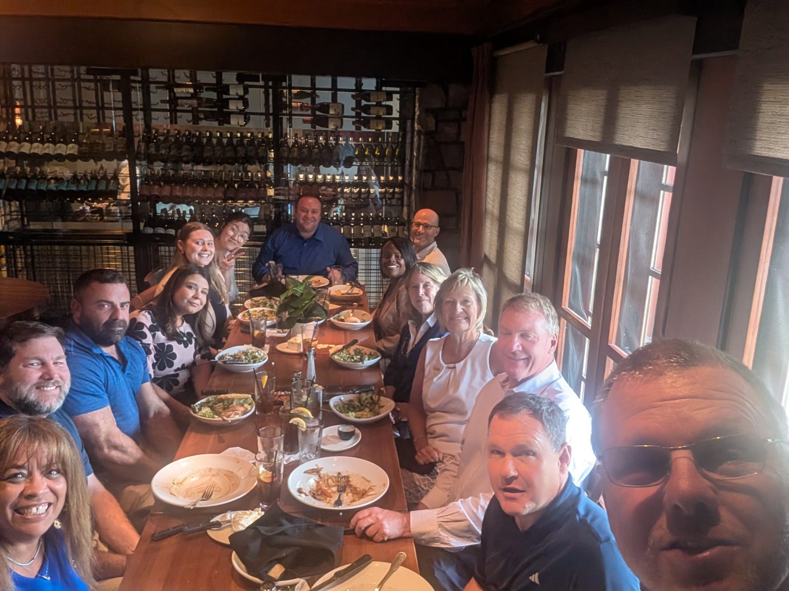 Guests sharing dinner around one table