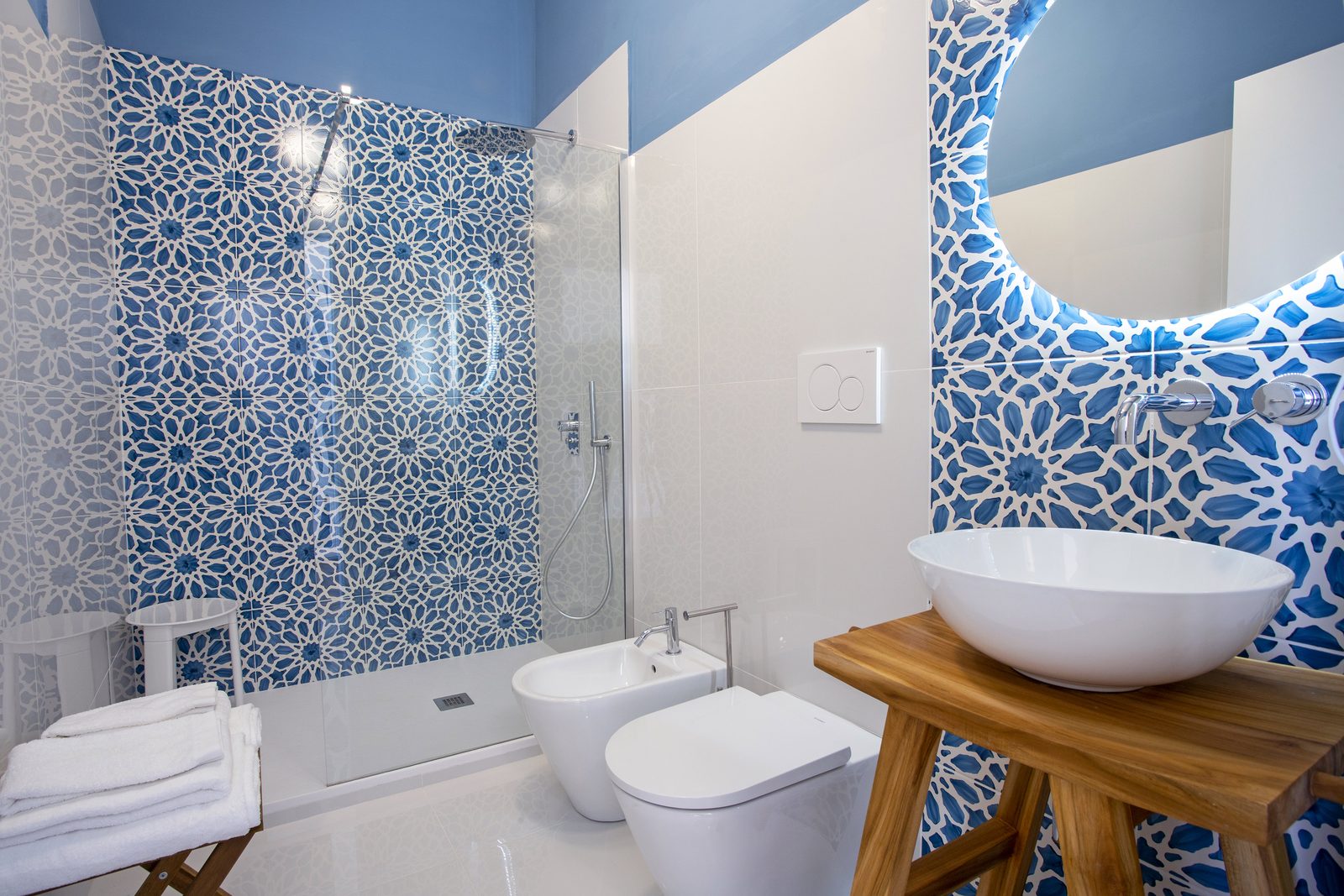 A bathroom with hand-painted tiles