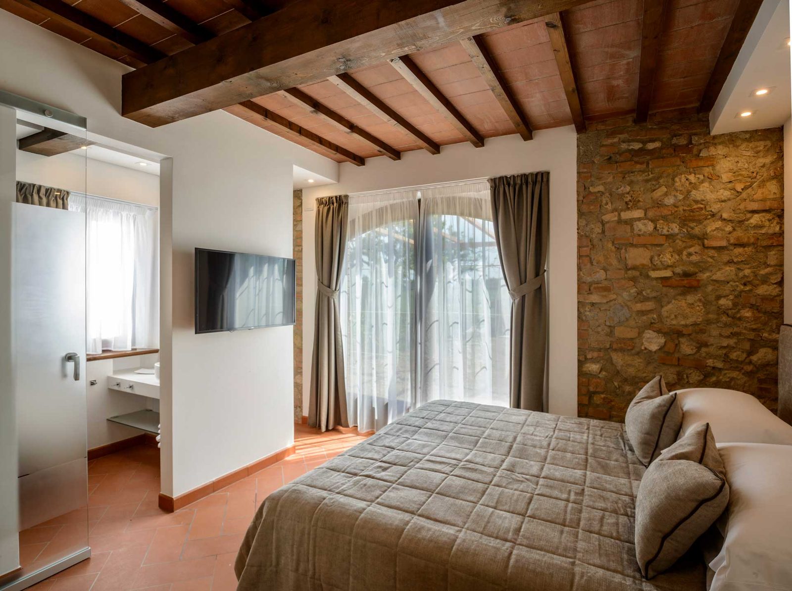 A guest room with wooden beams